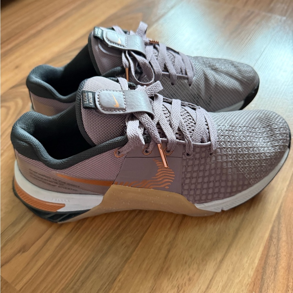 Light purple and gold Nike Metcon 8’s